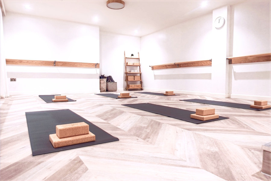 Mats and blocks are laid out neatly inside The Nooks yoga studio